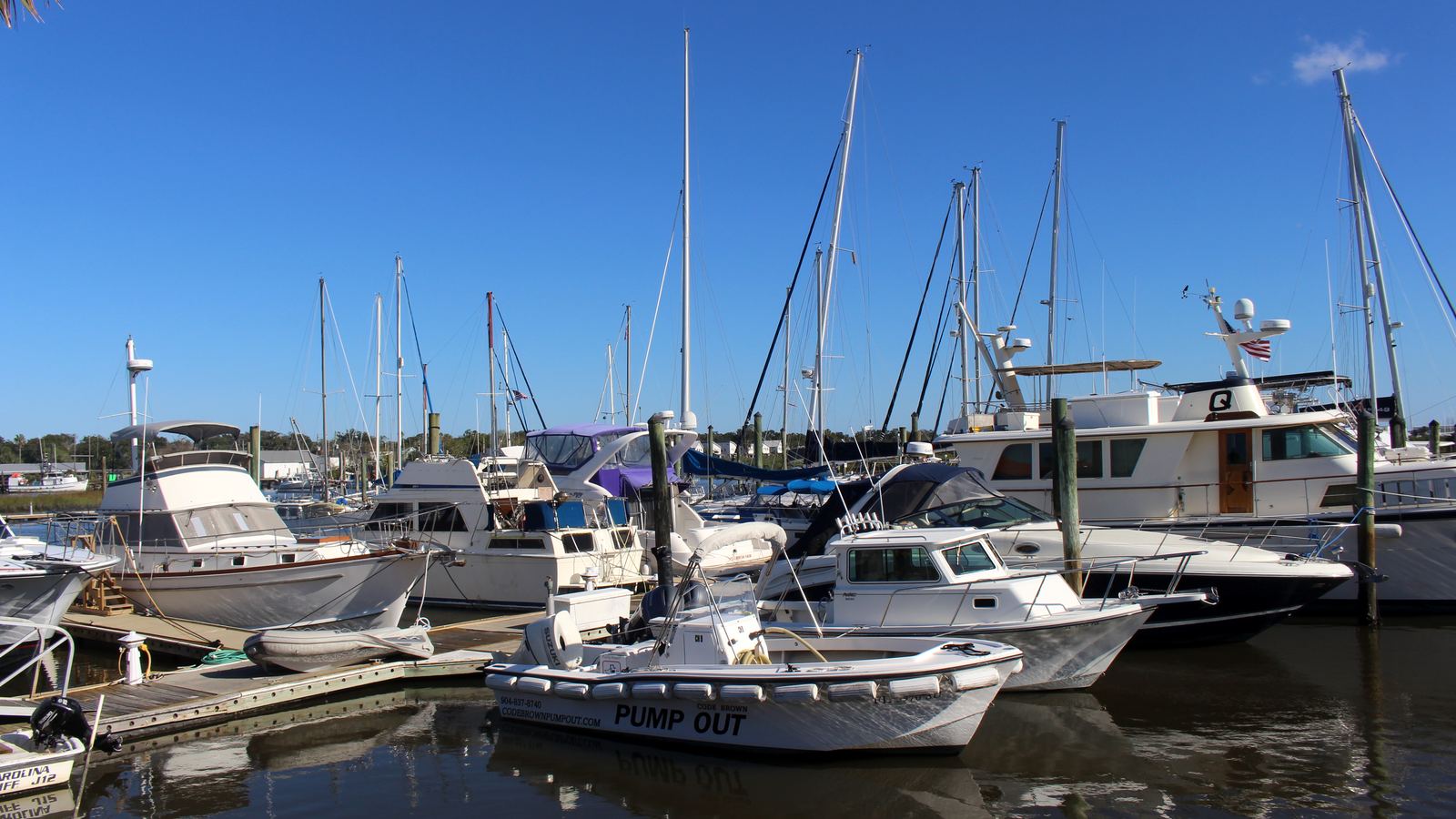 Sailboats and motor yachts docked at a marina on the San Sebastian River in St. Augustine